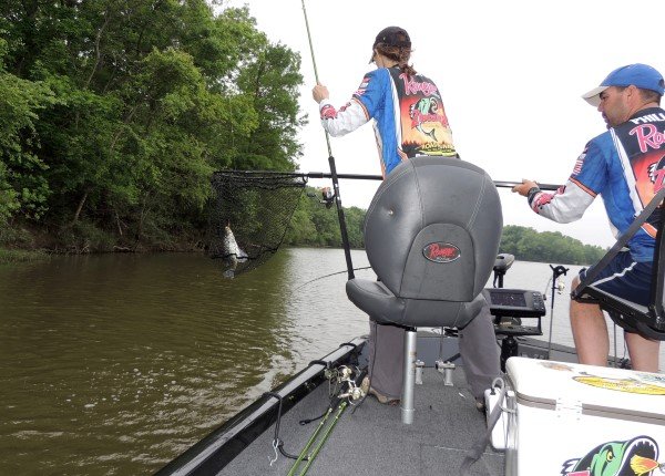 Alicia and Jonathan Phillips pull a crappie from the Alabama River. Knowing and reading current is an important part of river fishing.