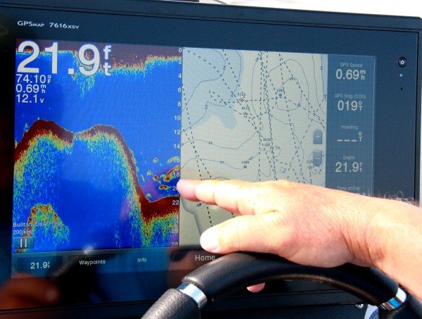 Electronics are primary tools when searching underwater structure. Dannenmueller uses his Garmin unit to look for just the right spot along a ledge.