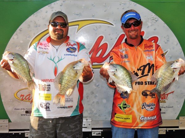 Semi-Pro Champs. Kyle Schoenherr and Rodney Neuhaus showing off some of their winning crappie at the Crappie USA Classic.