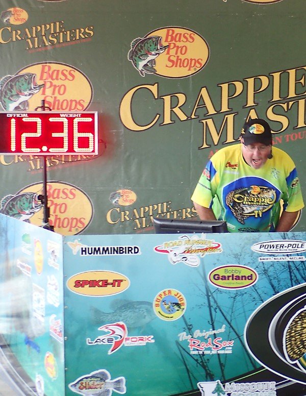 Seeing fish come across the scales is part of the tournament fun. Brian Sowers announces a good weight.