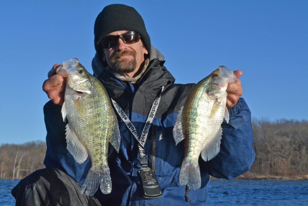 When water temperature drops into the high 30s at Kansas reservoirs, Joe Bragg piles on the clothes and goes crappie fishing. It’s one of the best times of year to catch big fish. These two crappie were part of his limit catch on a cold December day in eastern Kansas.