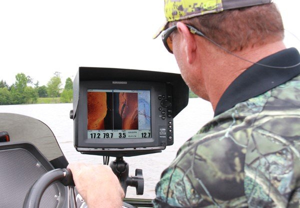 Electronics is the key to fishing deep, submerged structure. Brown takes his time to pinpoint spots he choses to fish.