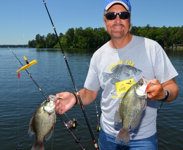 Garrett Steele, from Nashville, Tenn., shows off some crappie he caught while trolling a jig and a crankbait with planer boards on Lake Jordan near Wetumpka, Ala. With planer boards, anglers can spread out their rigs and cover more water by fishing various baits at multiple depths simultaneously.