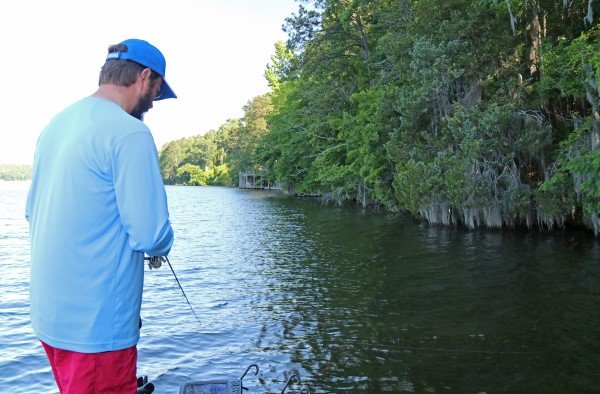 Alex Johnson makes a cast and retrieve to an underwater large rock.