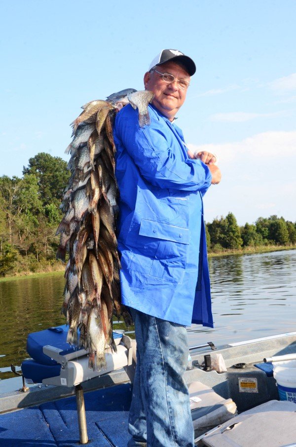Tony Adams of Eufaula, Alabama, holds two limits of crappie caught in 2 hours of fishing.