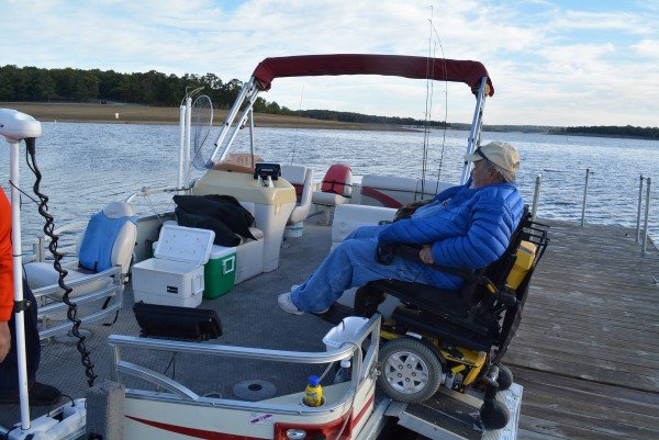 Terry Saldeen uses a ramp to get aboard his pontoon boat before embarking on another guide trip. He doesn't let his disability hold him back when he goes crappie fishing on Truman Lake. A partial quadriplegic, he is has spent the last seven years guiding customers to big fish out of his pontoon boat.