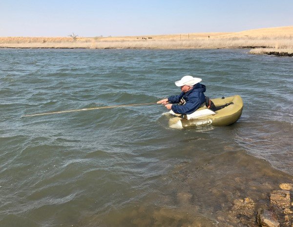 When the crappies move shallow to spawn in farm ponds, Hartman uses his fly rod to catch them.